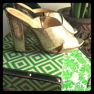 Gold slide heels . New in box . Retail $220.00